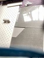 Pegboard panel, plastic accessory parts, gray storage box