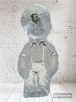 Front view of clear frosted glass boy figurine paperweight