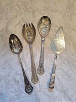 Front view of all four utensils displaying design and size