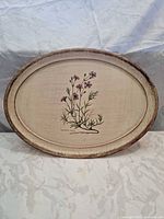 Front view of oval tray showing full floral decal and distressed finish