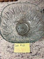 Top view of entire square clear glass bowl showing starburst pattern