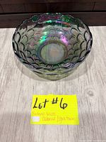 Angled view of the iridescent green Federal Glass Colonial Yorktown bowl showing scalloped rim and thumbprint pattern