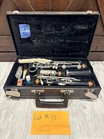 Open case showing clarinet parts and accessories