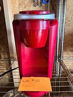 Front view of red Keurig coffee maker
