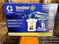Front angled view of boxed Graco TrueCoat 360 sprayer