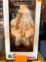 Santa figure in original open front box showing full height and power cord