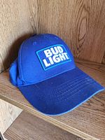 Overall view of the blue Bud Light baseball cap showing logo patch, curved brim and general condition