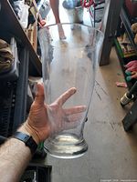 Front view of the large clear glass trumpet-shaped vase held upright showing overall shape and scale