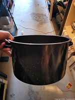 Exterior view of black speckled enamel stock pot