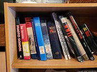 Shelf view showing spines of all books in lot