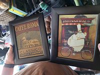 Both framed prints front view showing artwork and black frames