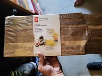 Factory-sealed pack of three acacia wood serving boards with President's Choice label visible