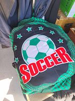 Green and black kids soccer blanket folded
