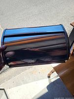 Exterior view of stainless steel bread box showing reflective finish