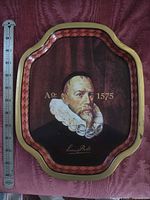 Front view showing portrait, border and ruler for scale