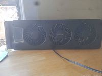 Front view showing three fans and power cord