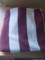 towel folded showing burgundy and white stripes