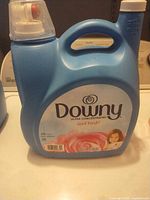 Front of Downy Ultra Concentrated fabric softener bottle showing label and size