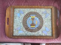 Front view of wood tray showing butterfly wing art under glass