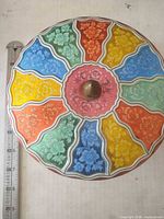 Top view showing multicolor floral lid design and measuring tape