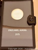 Medal in presentation case showing title text