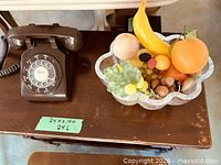 Telephone and crystal bowl on table