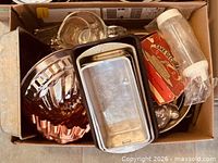 Box overview showing various baking pans and tools