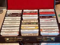Open briefcase showing full set of cassettes