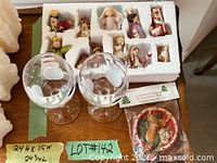 Overview of lot showing nativity figures tray, two snowman wine glasses, sealed bear ornament
