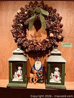 Overall lot showing wreath, two lanterns and Santa figurine