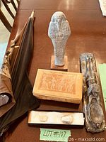 Full lot view showing umbrella, ushabti, trinket box, metal holder, stones
