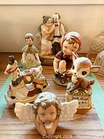 Full group of six figurines on tabletop