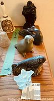 All five figurines on shelf