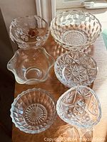 All six glass bowls arranged on tabletop