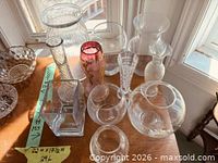 Group view of all 11 glass pieces on tabletop