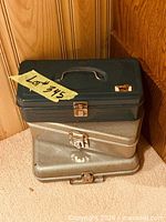 Stacked three metal lockable boxes showing exteriors