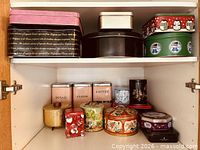 Both shelves showing full assortment of tins