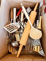 Top view of box showing entire assortment of utensils
