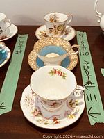 Three teacup and saucer sets on table