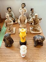group shot showing majority of figurines and vases