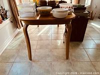 Full view of table front showing shape, legs and size