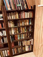 Full view of one of the seven shelves filled with books