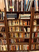 Full view of shelves filled with assorted books