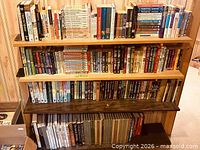 Wide view of full four-shelf bookcase with assorted books