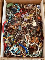 Top view of entire jewelry lot in box