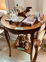 Top view of round table with decorative inlay and items on surface