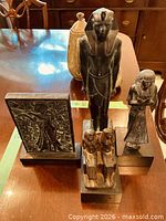 Group shot of four Egyptian reproduction pieces on table