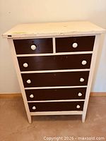 Front view of six-drawer painted dresser