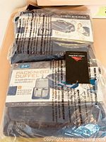 Pair of sealed High Sierra Pack-N-Go duffels in plastic wrap