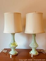 Full view of both matching Murano art glass lamps with shades